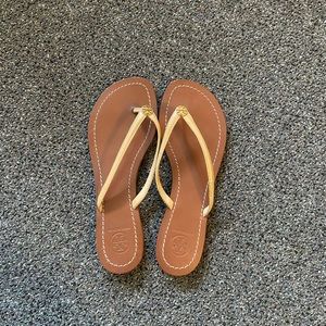 Tory Burch tan leather flip flops